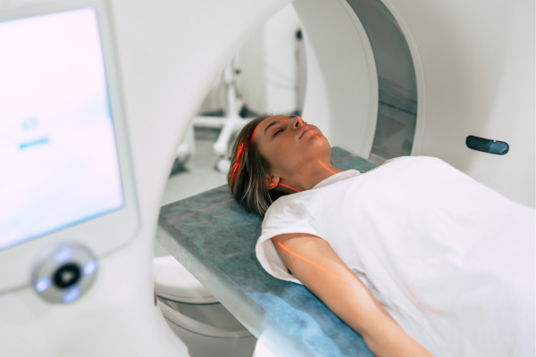 A women laying in an MRI machine having a scan.