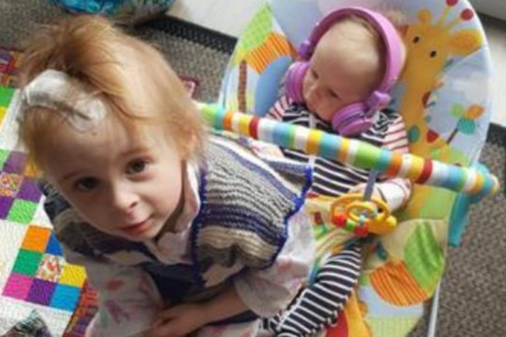 Eleanor playing with baby and toys