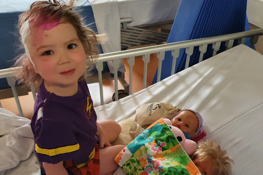 Sophie in hospital after brain surgery