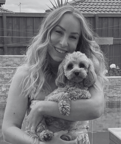 Kathryn, living with stage 4 appendix cancer, pictured with her dog