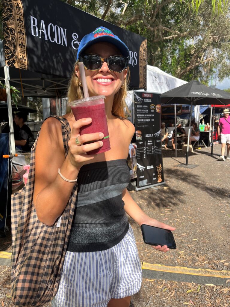 Kelly on holiday holding a smoothie in her hand