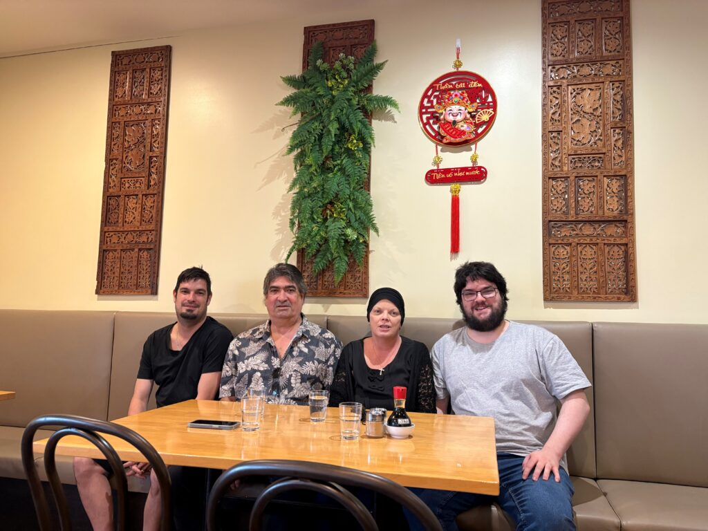 Karen sitting in a resturant with her family